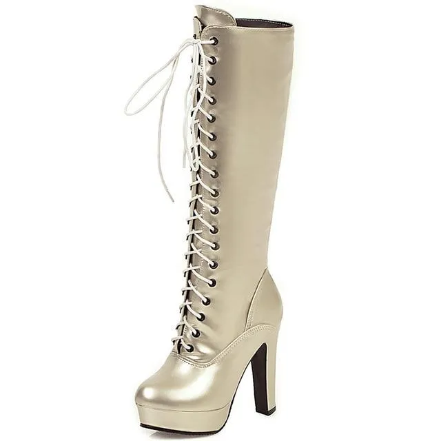 Women's knee high metallic platform high heeled combat boots with zipper